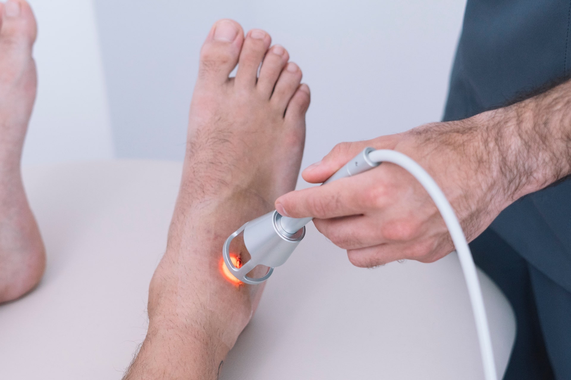 Laser therapy being performed on foot